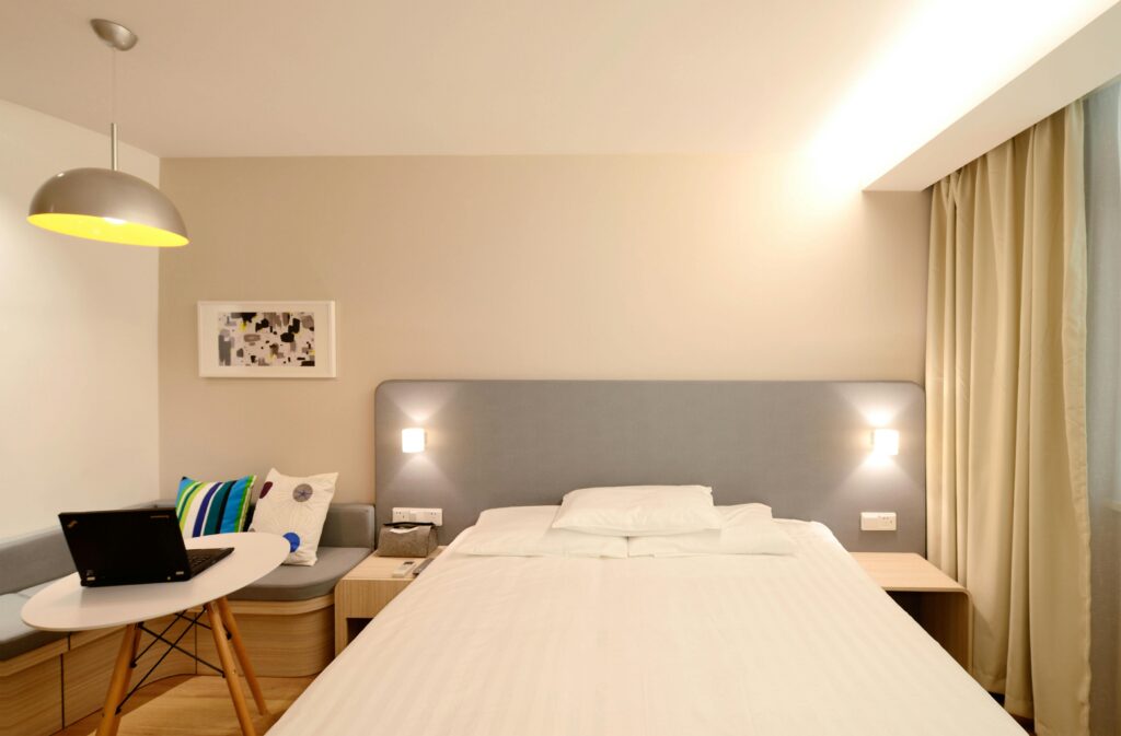 pexels-photo-271619-271619 Contemporary hotel room with minimalist interior design and cozy lighting.